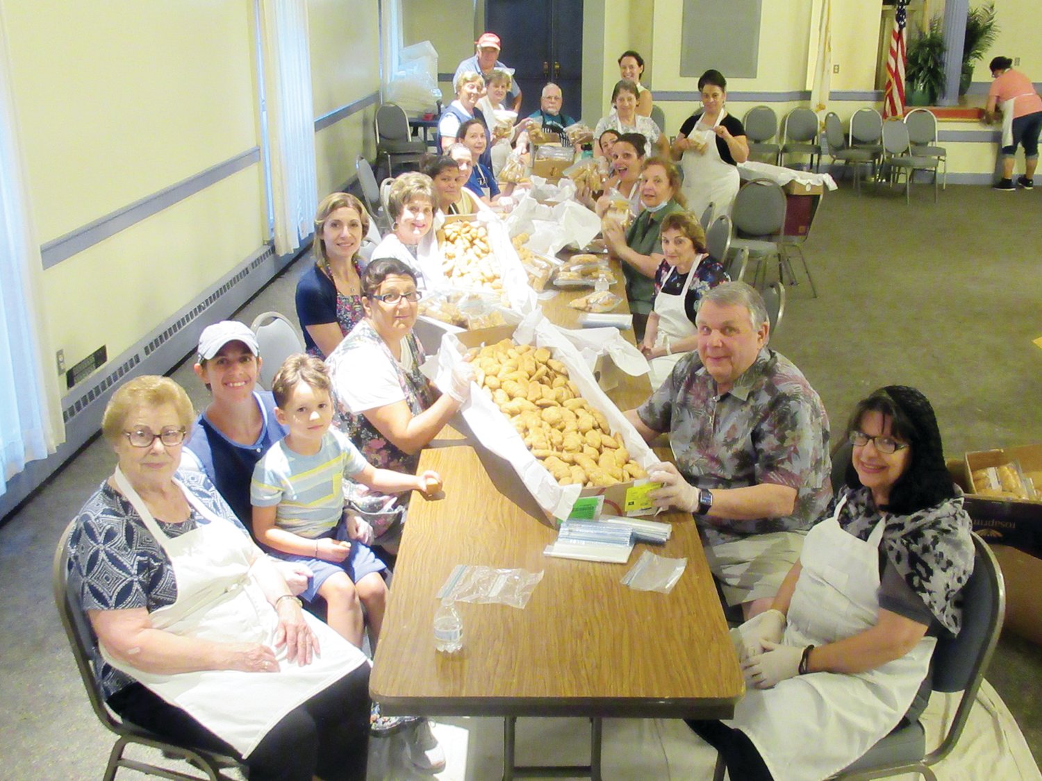 BAKING BRIGADE: This is just one example of the many proud parishioners at Church of the Annunciation who spent many recent nights making and baking what resulted in upwards of 40,000 Greek goodies that will be on sale during the 36TH Annual Cranston Greek Festival this weekend.